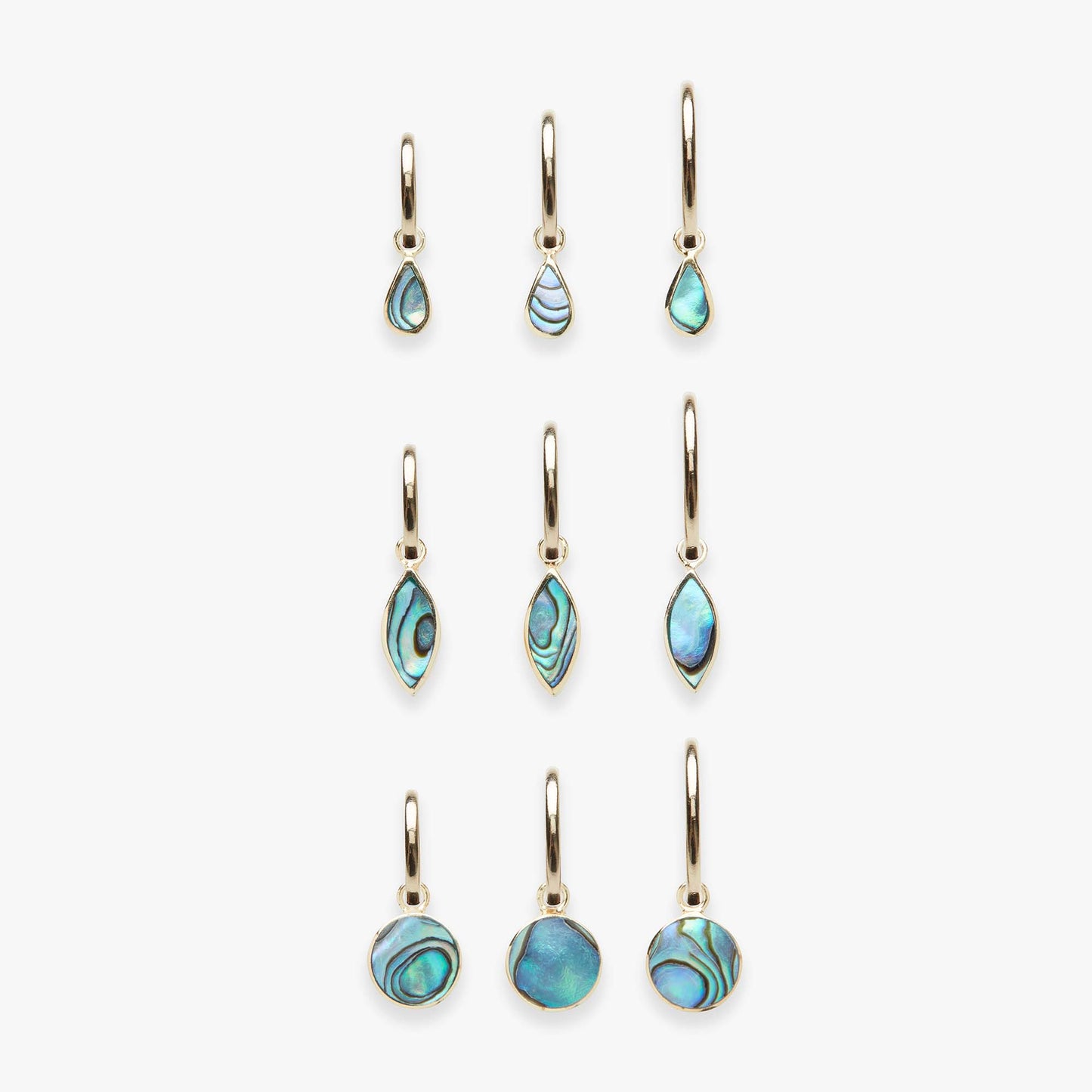 Set of abalone teardrop and round earrings on a white background