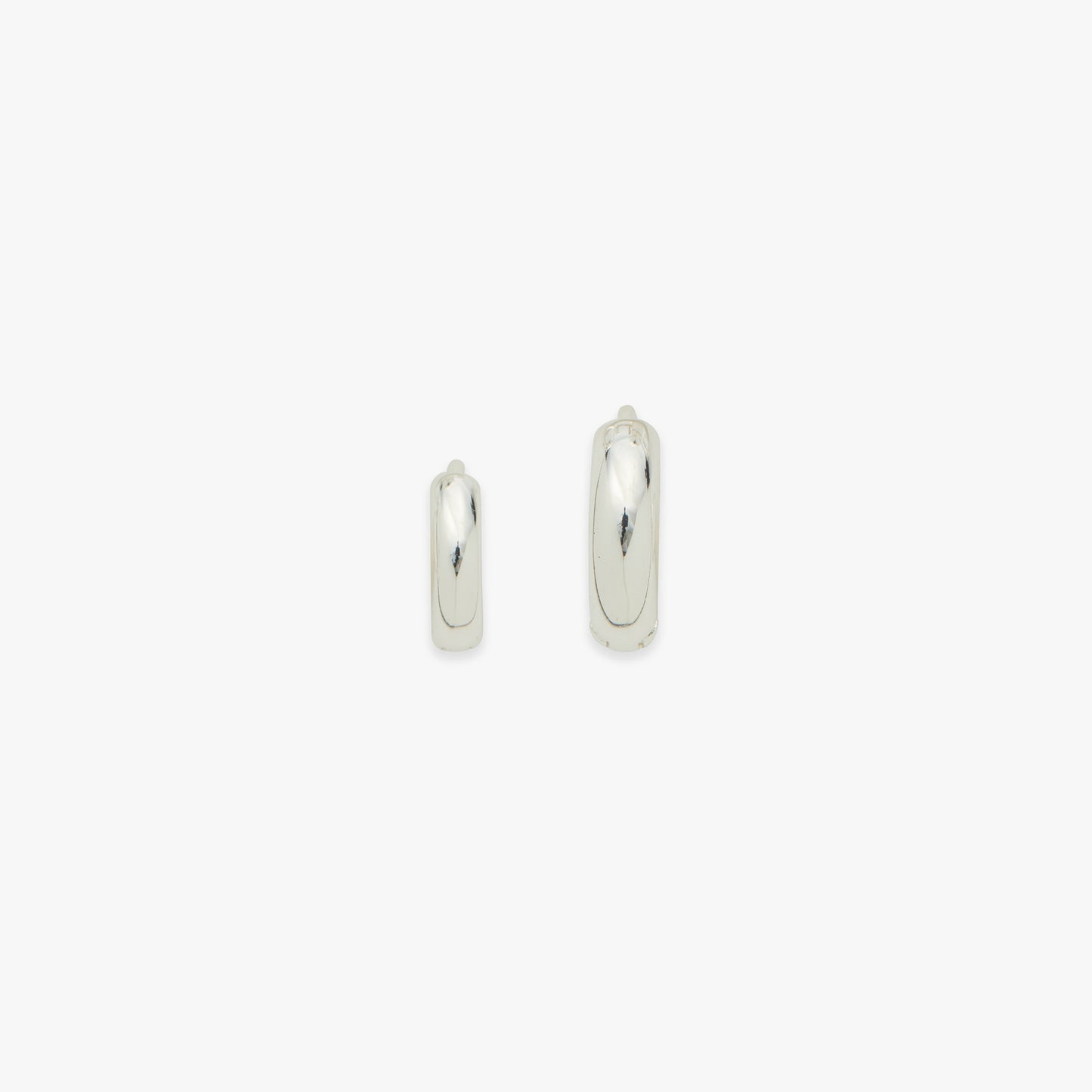 Pair of silver hoop earrings on a white background
