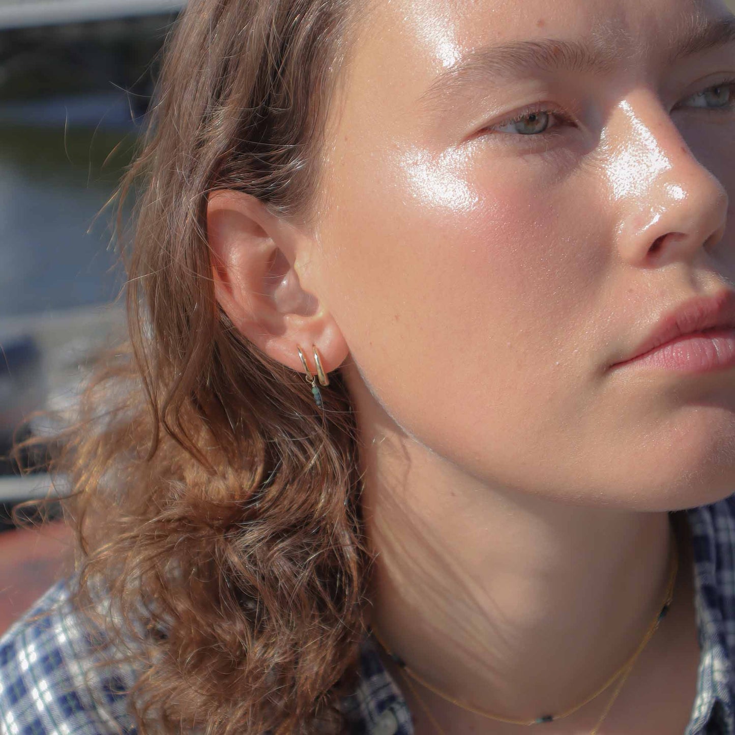 Close-up of a person with sun-kissed skin outdoors