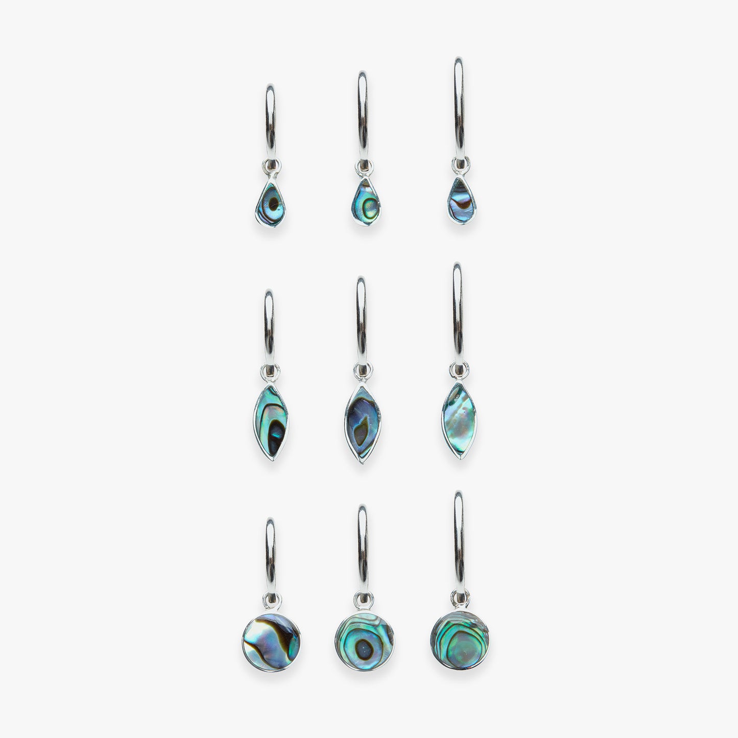 Set of earrings with green and black stone designs on a white background