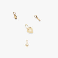 Set of gold charms on a white background
