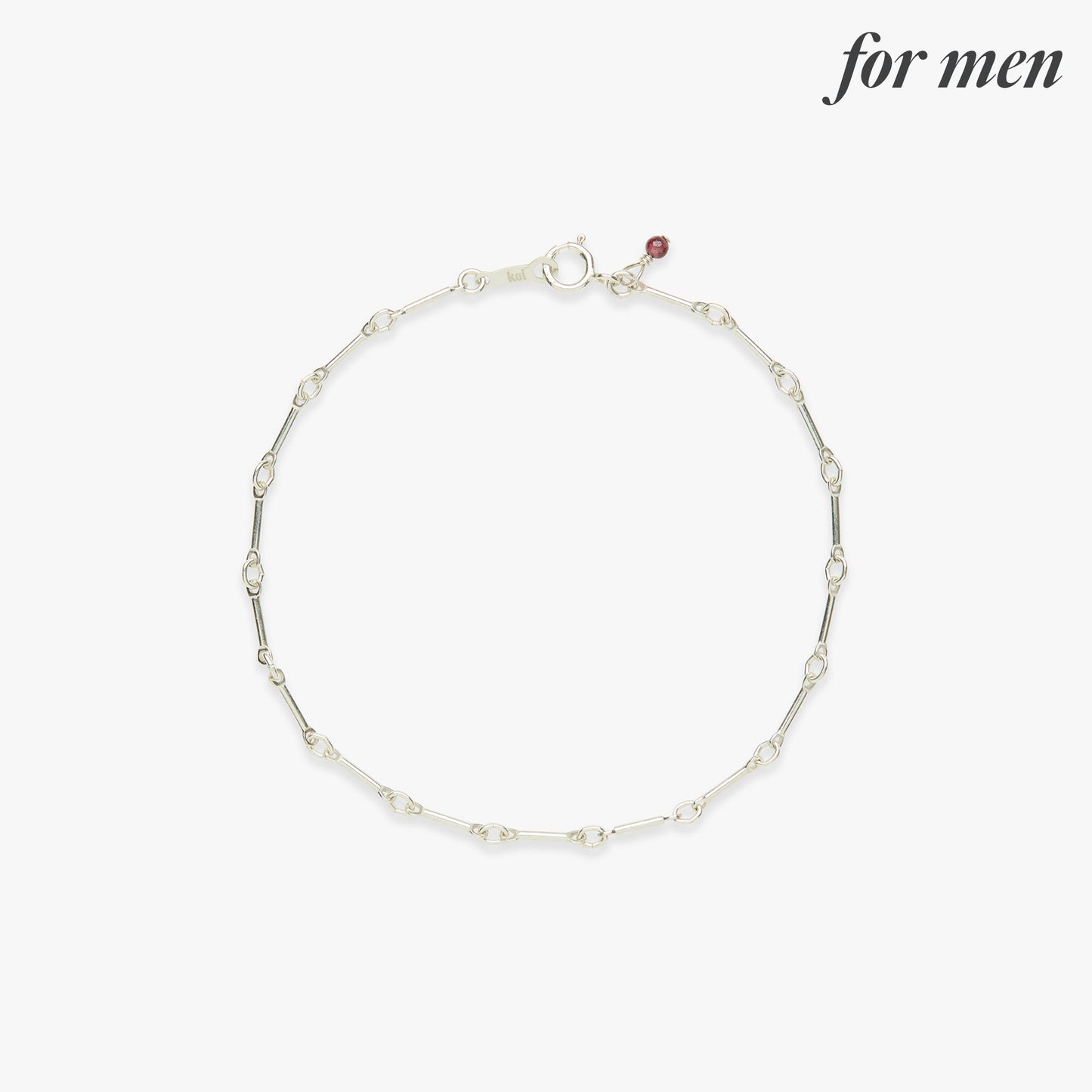Silver bracelet with small bead on a white background