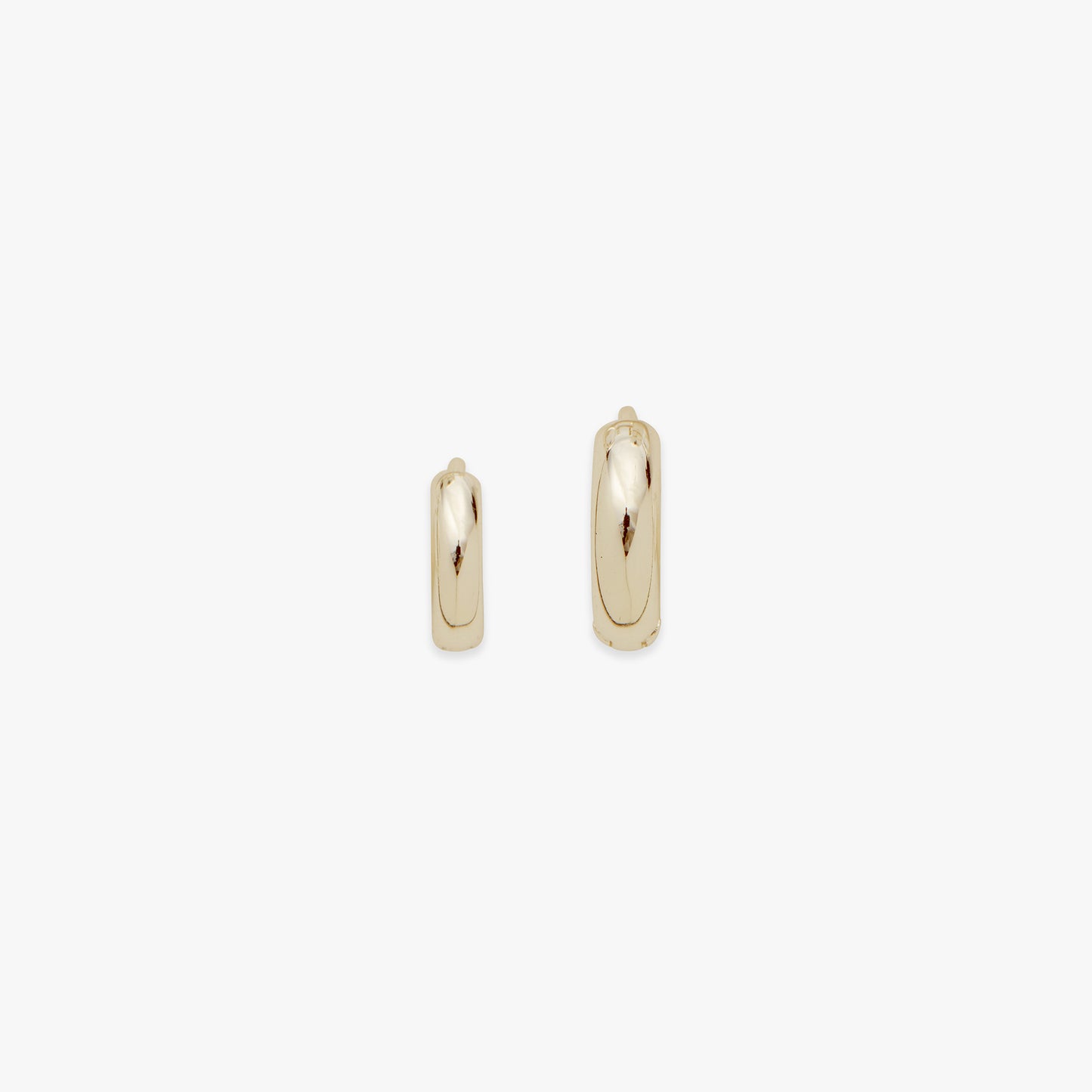 Gold hoop earrings on a white background