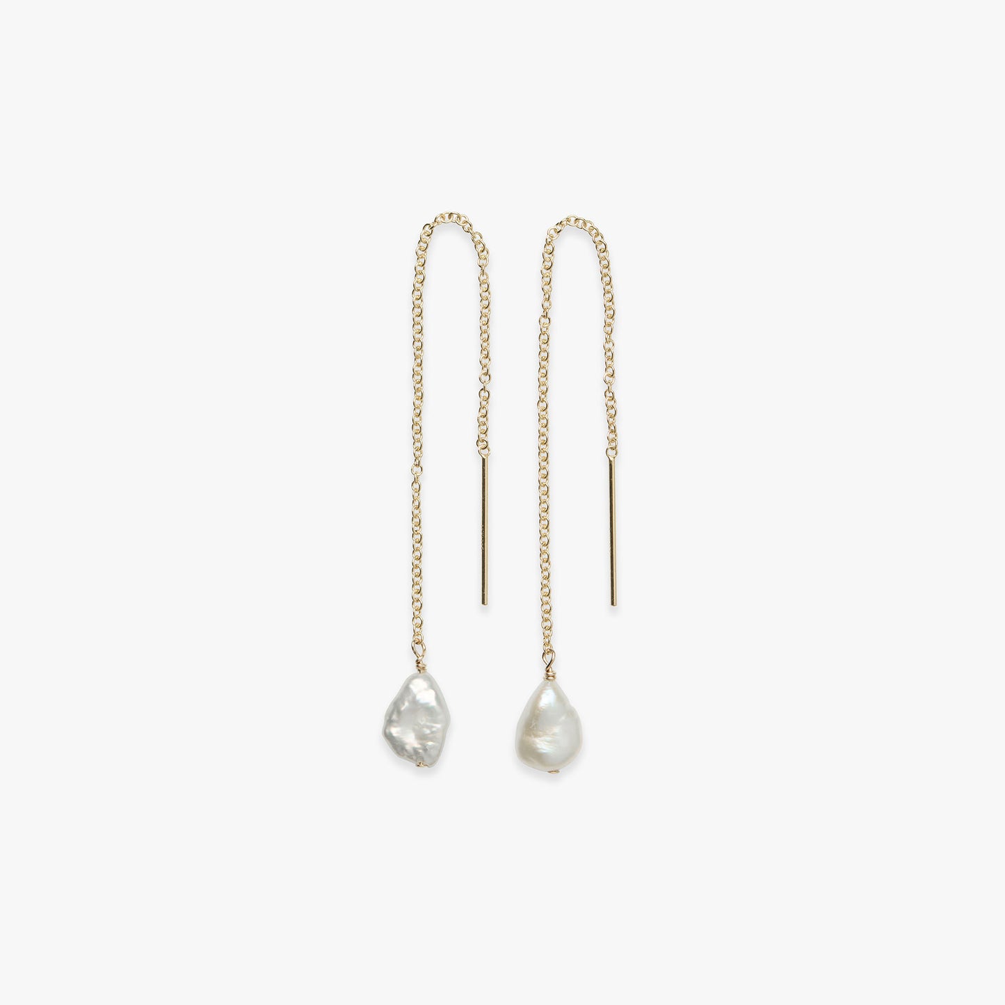 Pair of gold chain earrings with teardrop-shaped pearls on a white background