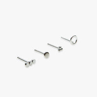 Set of silver stud earrings on a white background