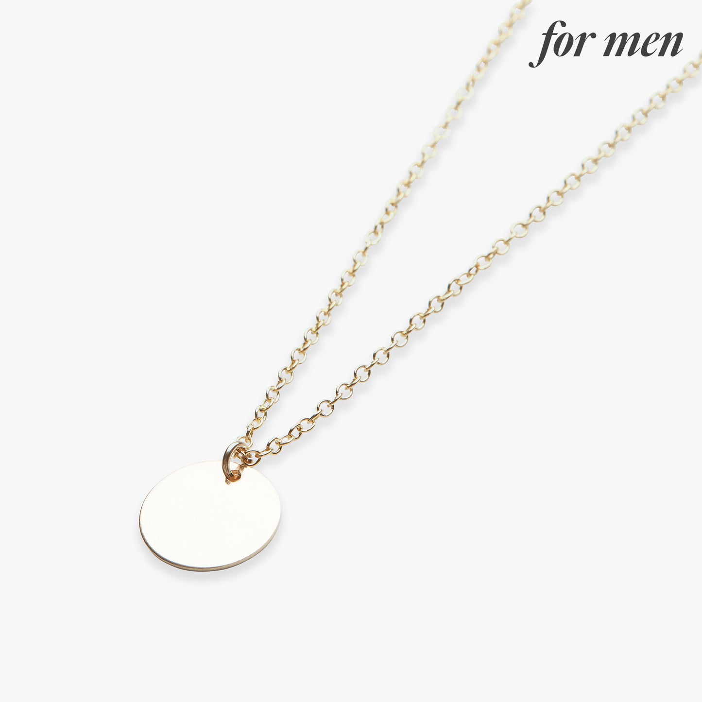 Gold necklace with a round pendant on a white background