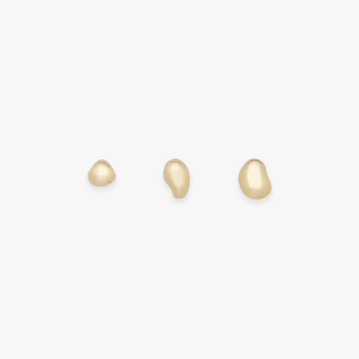 Set of three organic blob studs on a white background