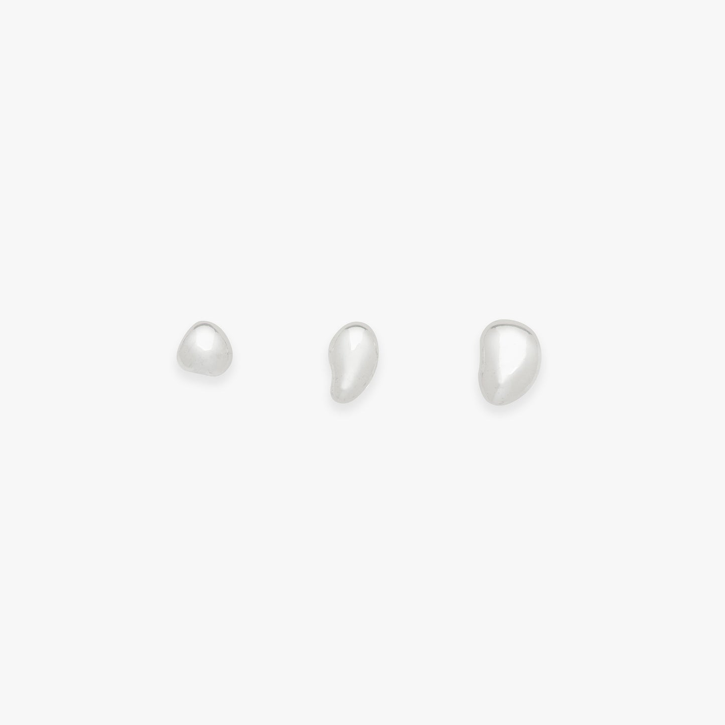 Set of three organic blob studs on a white background