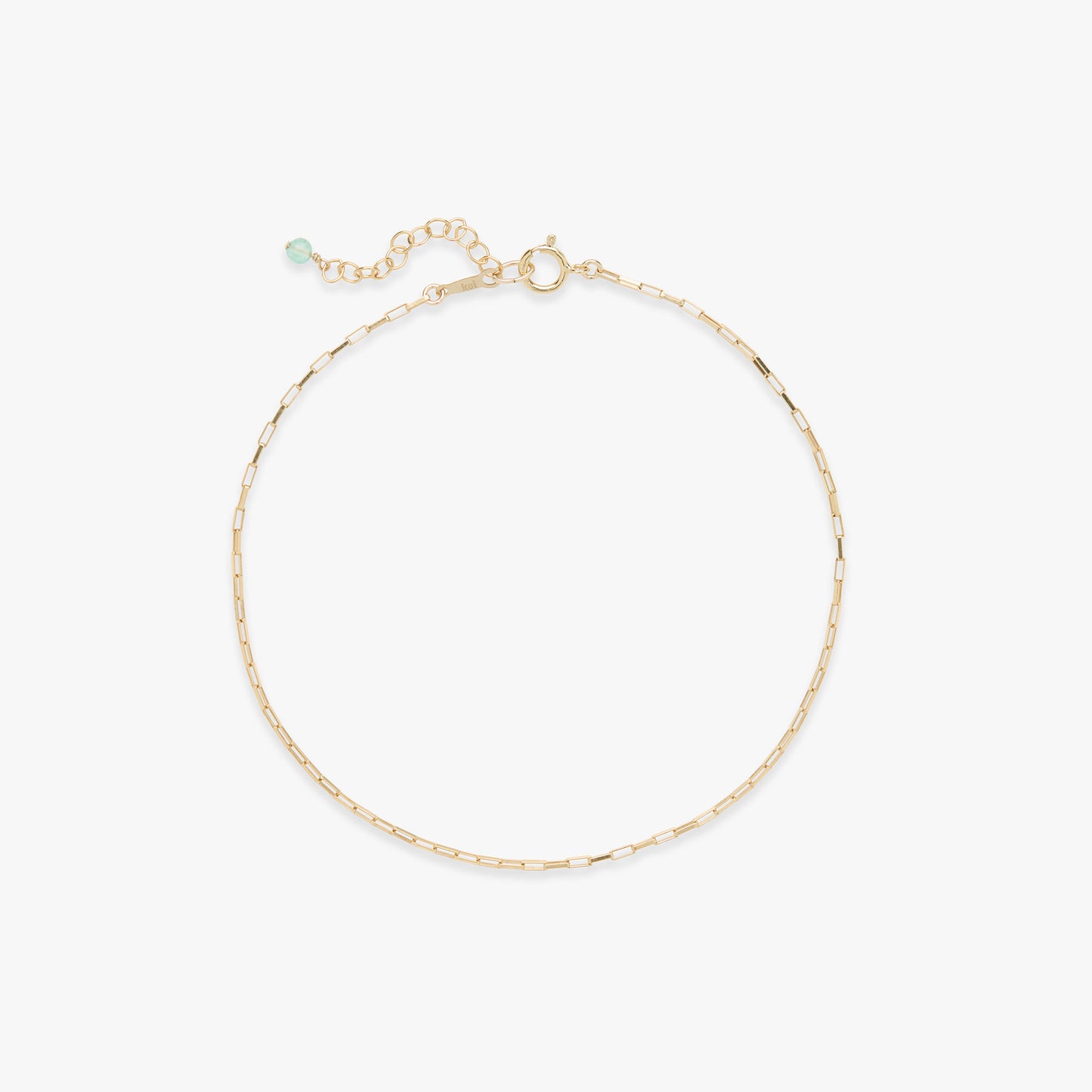 Gold anklet on a white background
