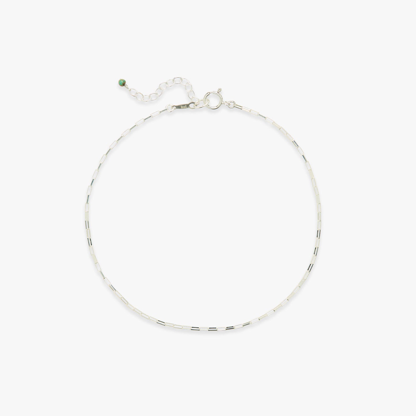 Silver anklet on a white background