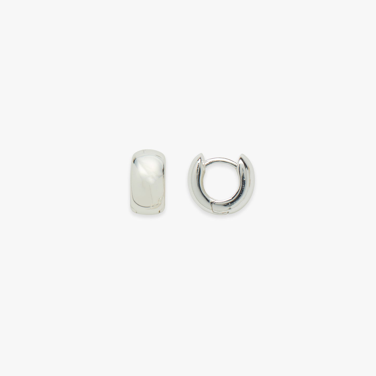 Two silver chubby hoop earrings on a white background