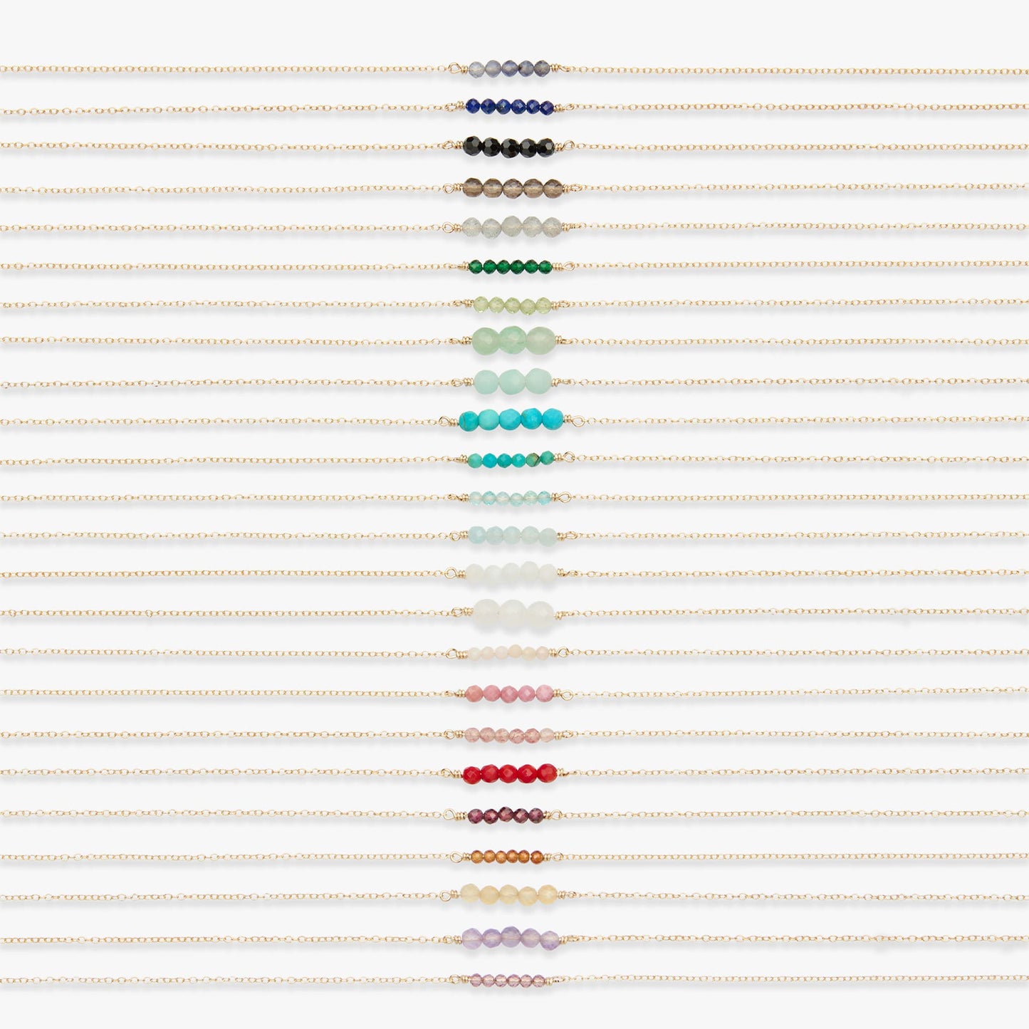 A vertical array of delicate beaded bracelets on dainty chains, each featuring a horizontal row of small round beads in different colors including blue, black, brown, green, turquoise, light blue, white, pale pink, red, and lavender, set against a clean white background.