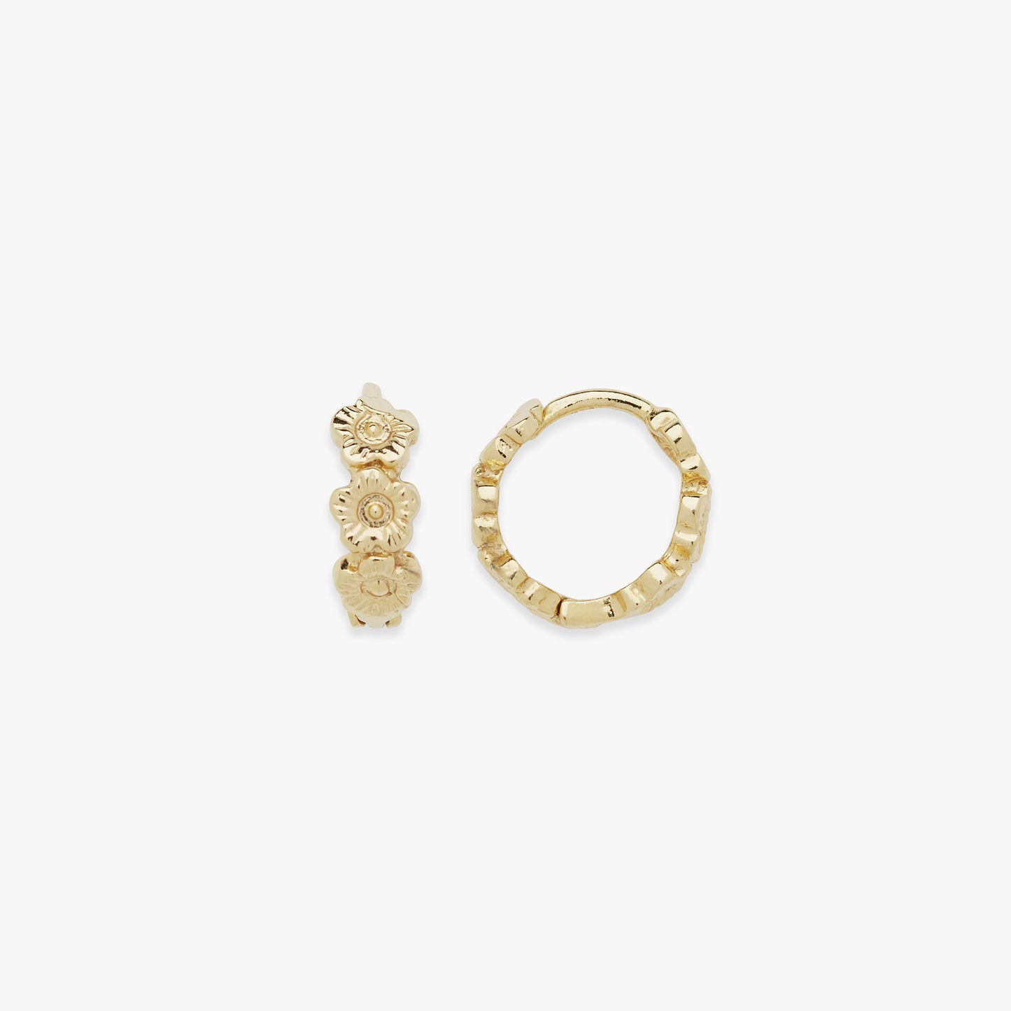 Gold flower hoop earrings on a white background
