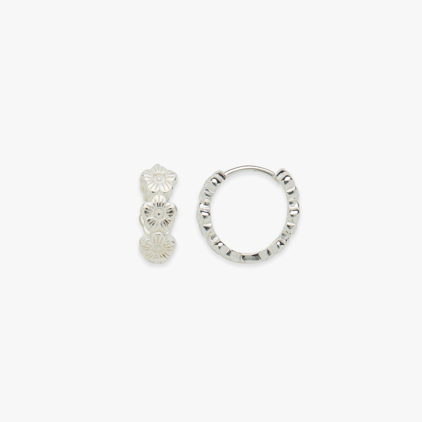 Silver daisy click hoop earrings on a white background