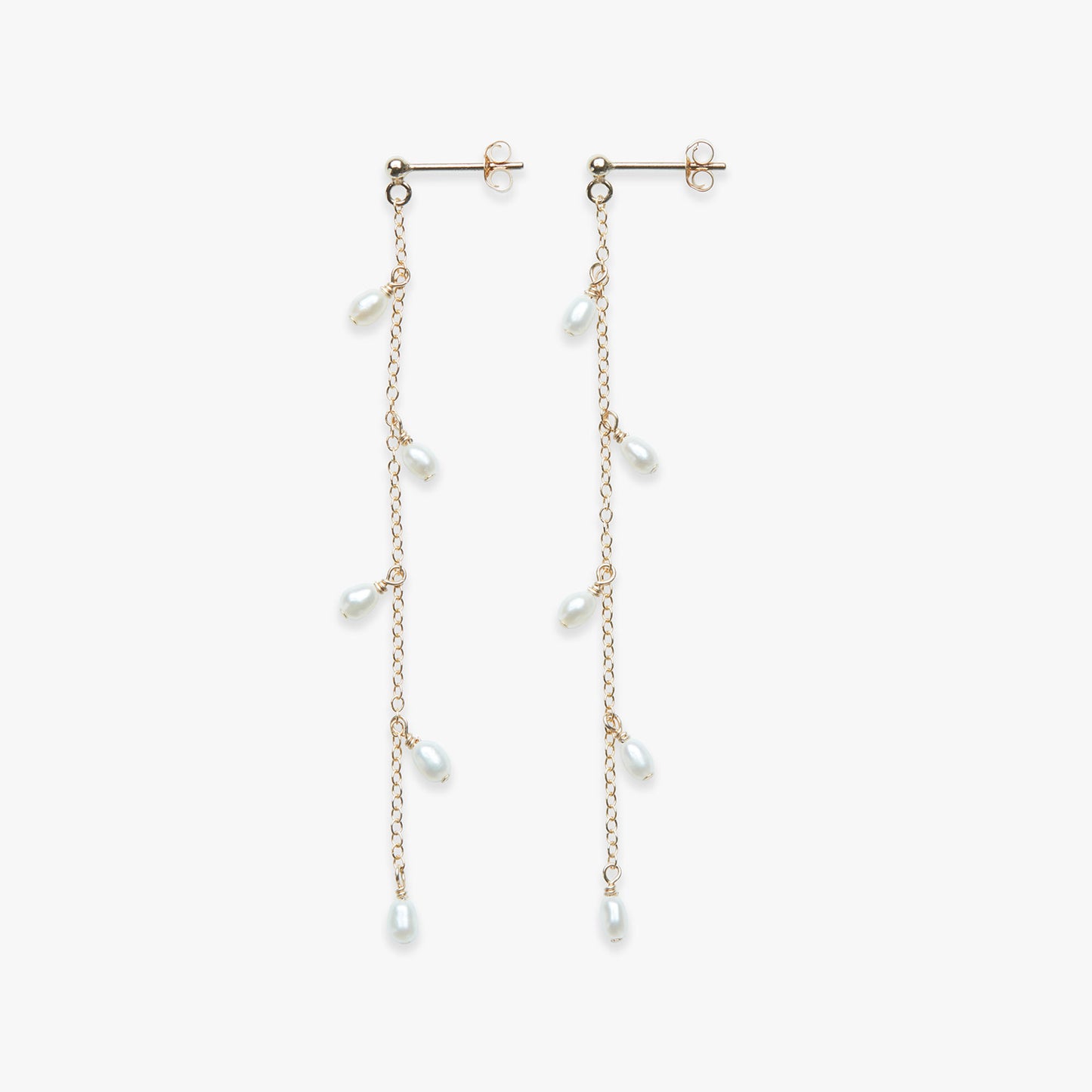 Pair of pearl drop earrings on a white background