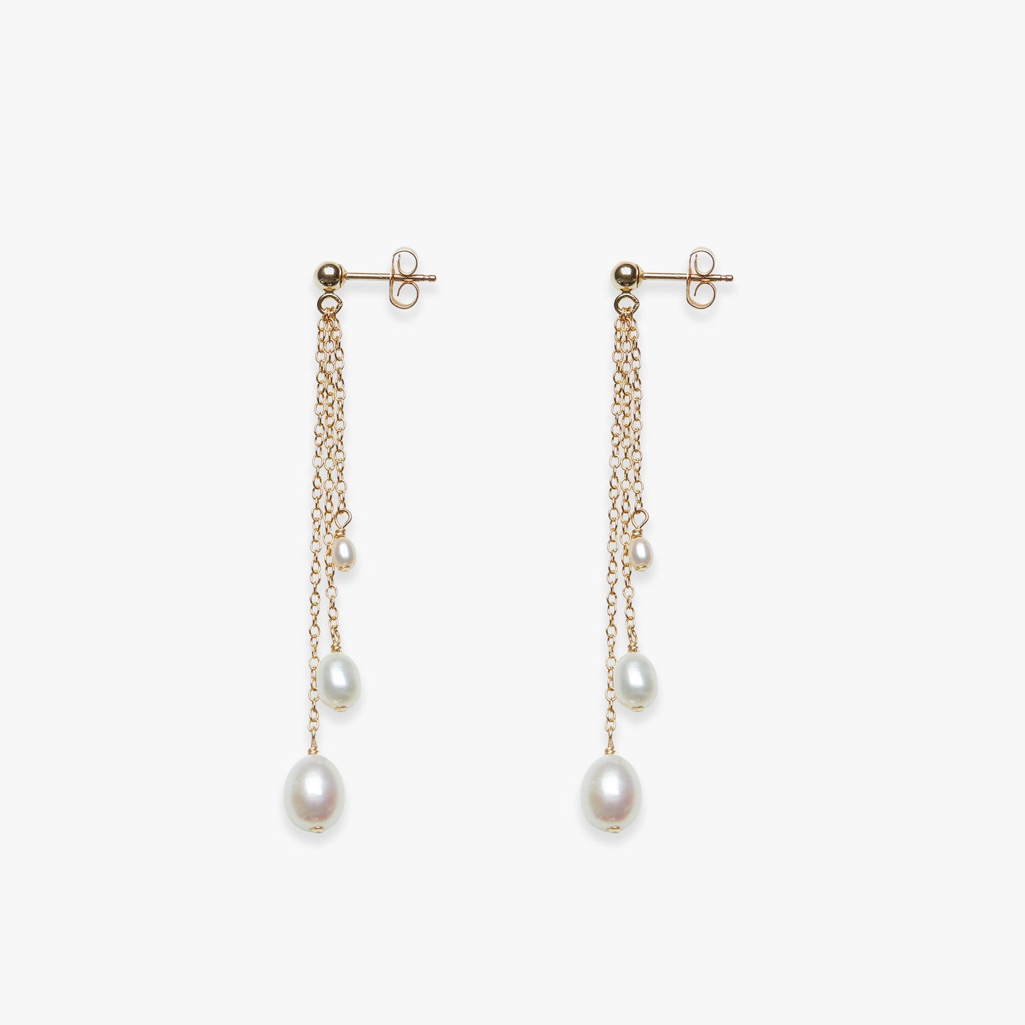 Pair of pearl drop earrings on a white background