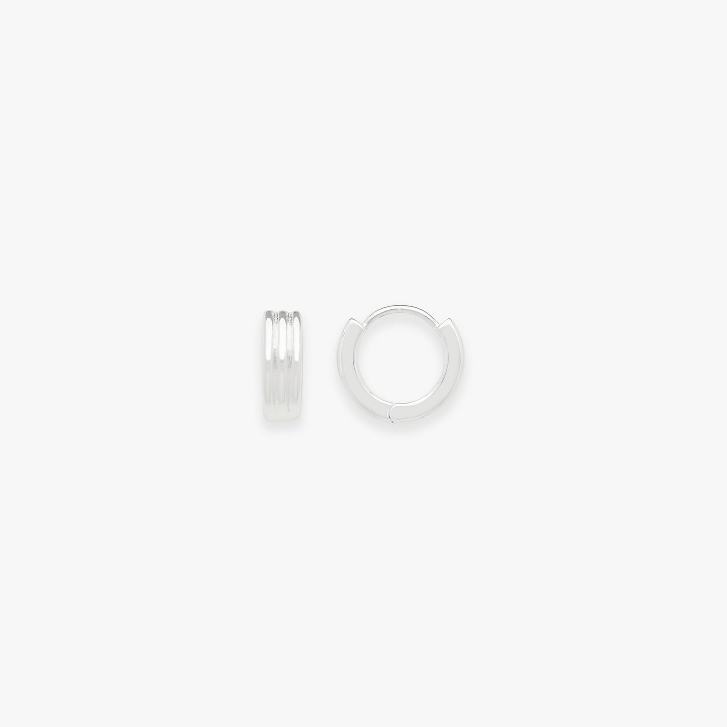 Two silver hoop earrings on a white background