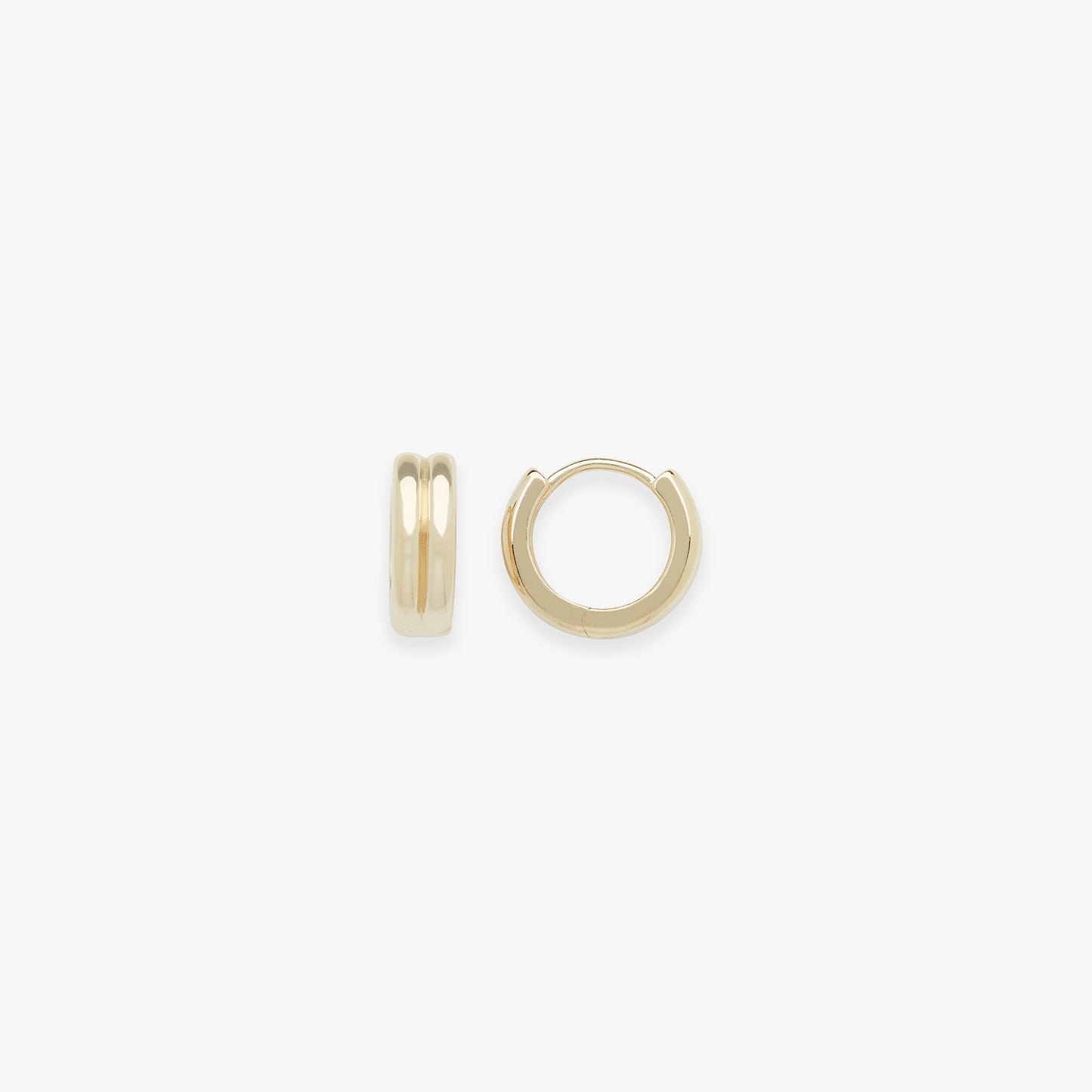 Gold hoop earrings on a white background