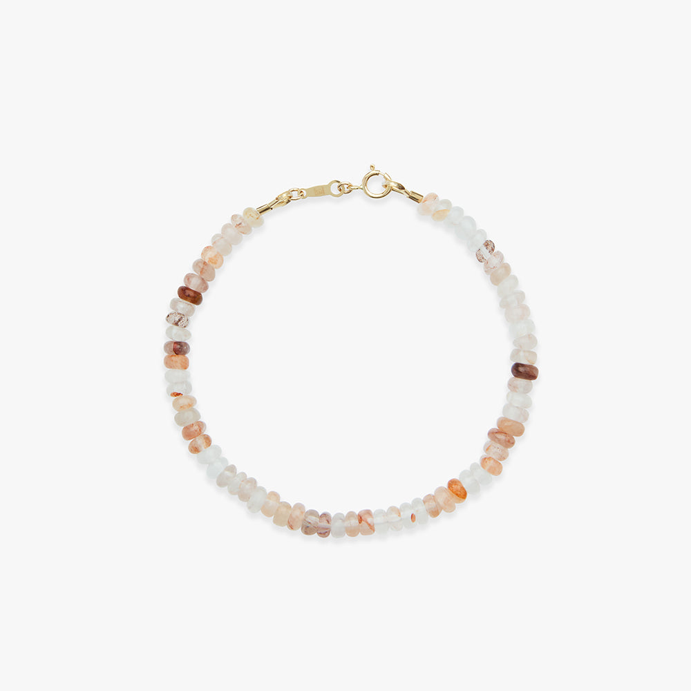 Beaded bracelet with gold clasp on a white background