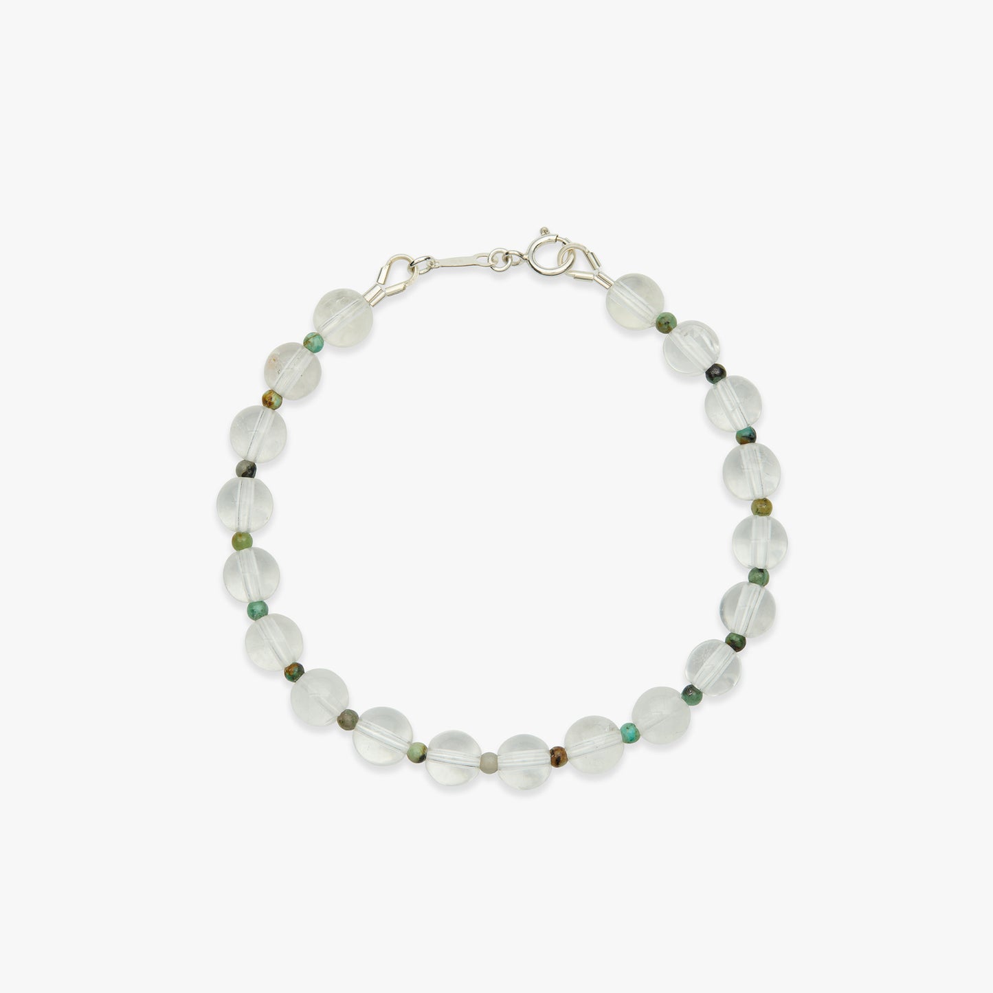 A beaded bracelet made of translucent white faceted beads with small scattered green and brown accent beads, finished with a silver-toned spring ring clasp, shown on a light gray background.