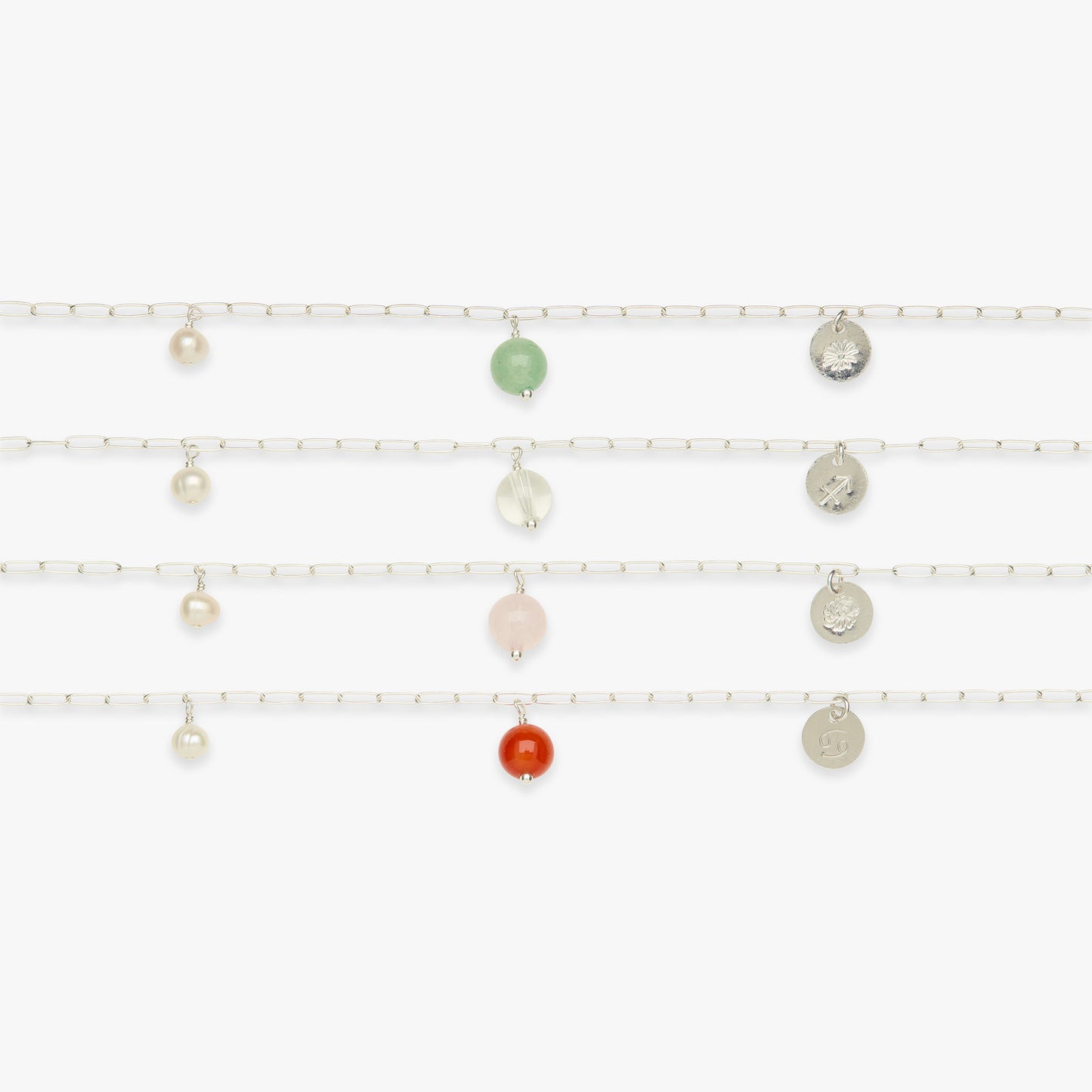 Set of pearl bracelets with various colored beads on a white background