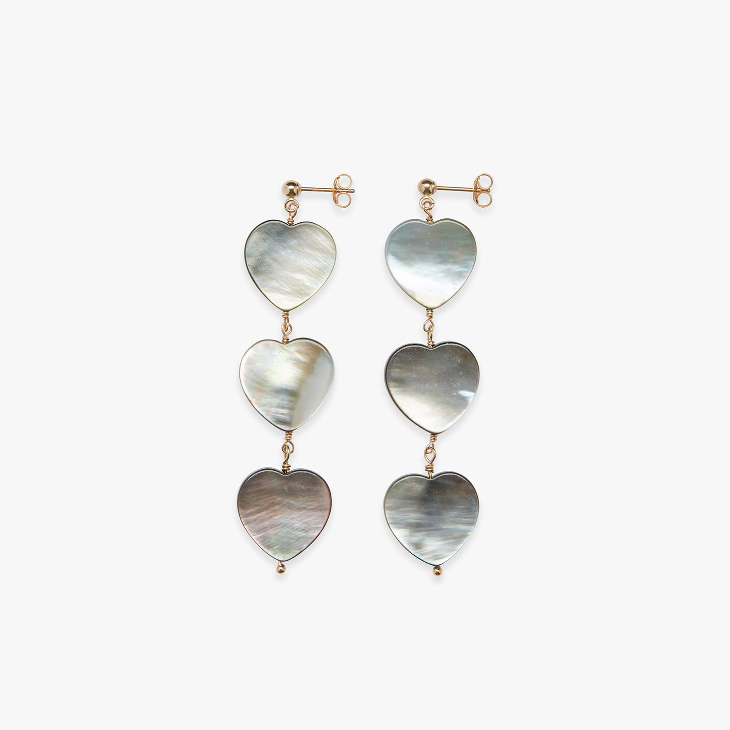 Heart-shaped earrings with mother-of-pearl finish on a white background