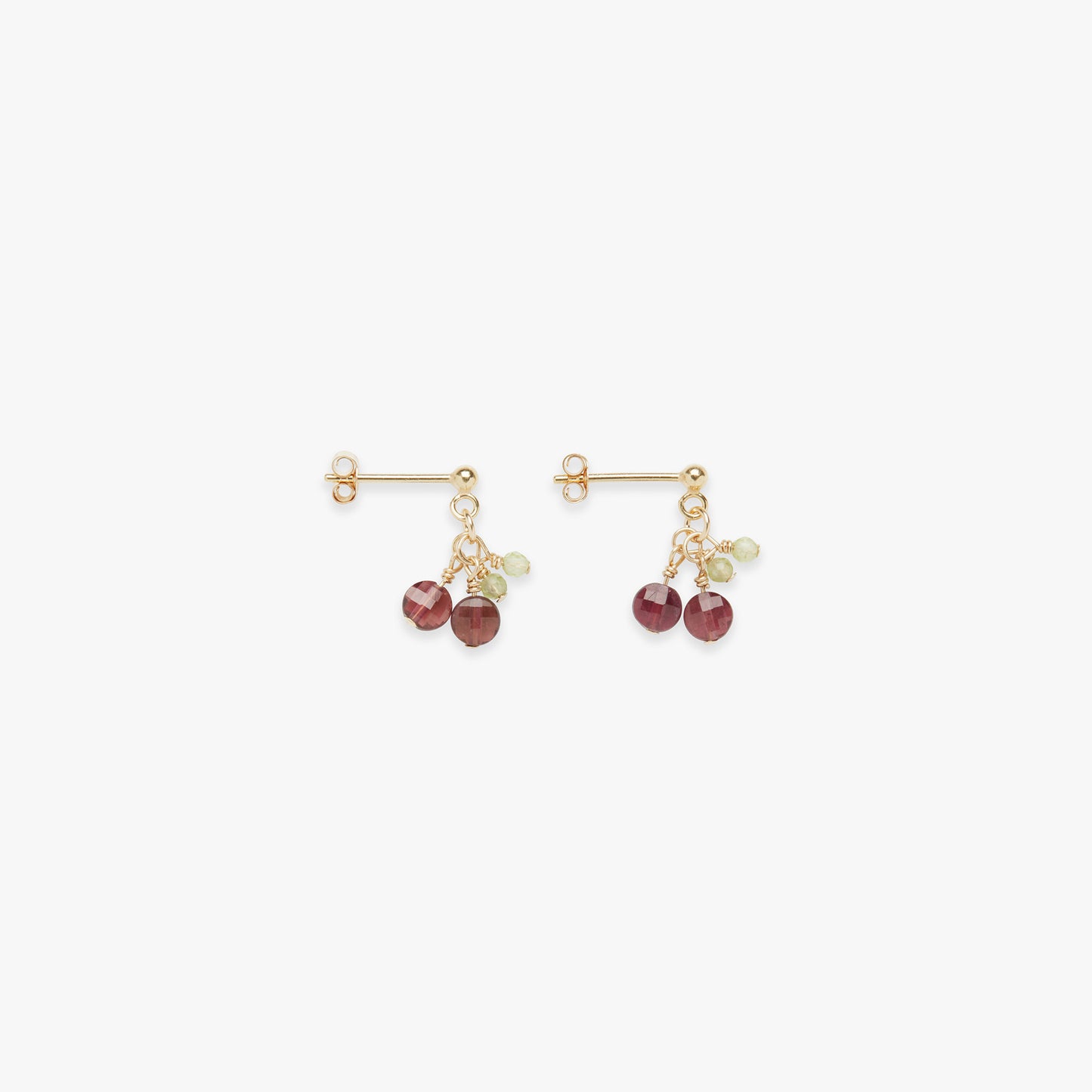 A pair of gold-filled mini cherry stud earrings with red gemstones, displayed against a white background.