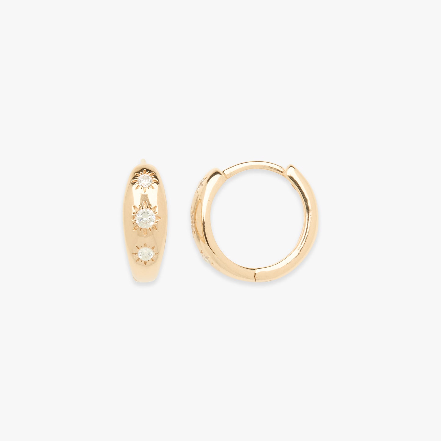 Gold hoop earrings with embedded stones on a white background