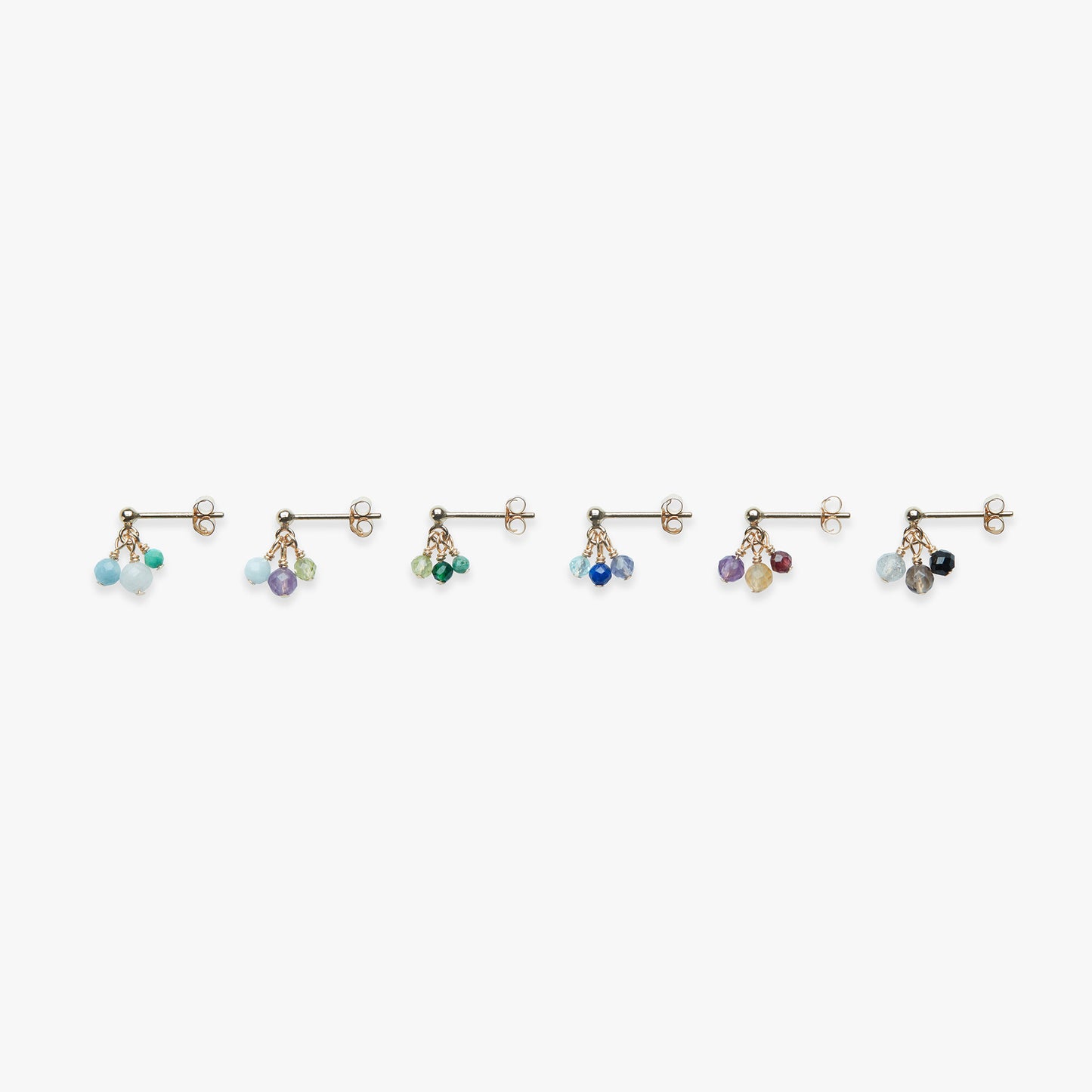 Set of earrings with colorful beads on a white background