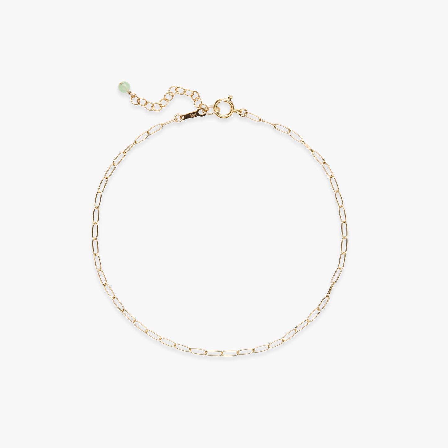 Gold chain anklet on a white background