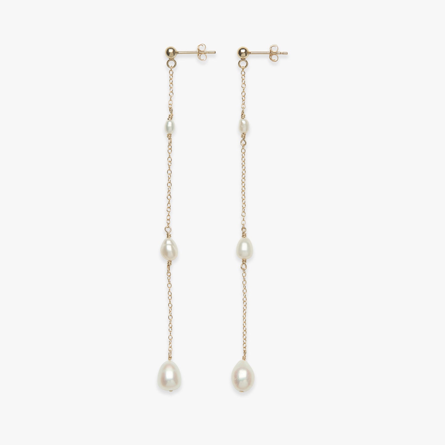 Pair of pearl drop earrings on a white background