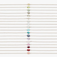 Multiple bracelets with colorful beads on a white background