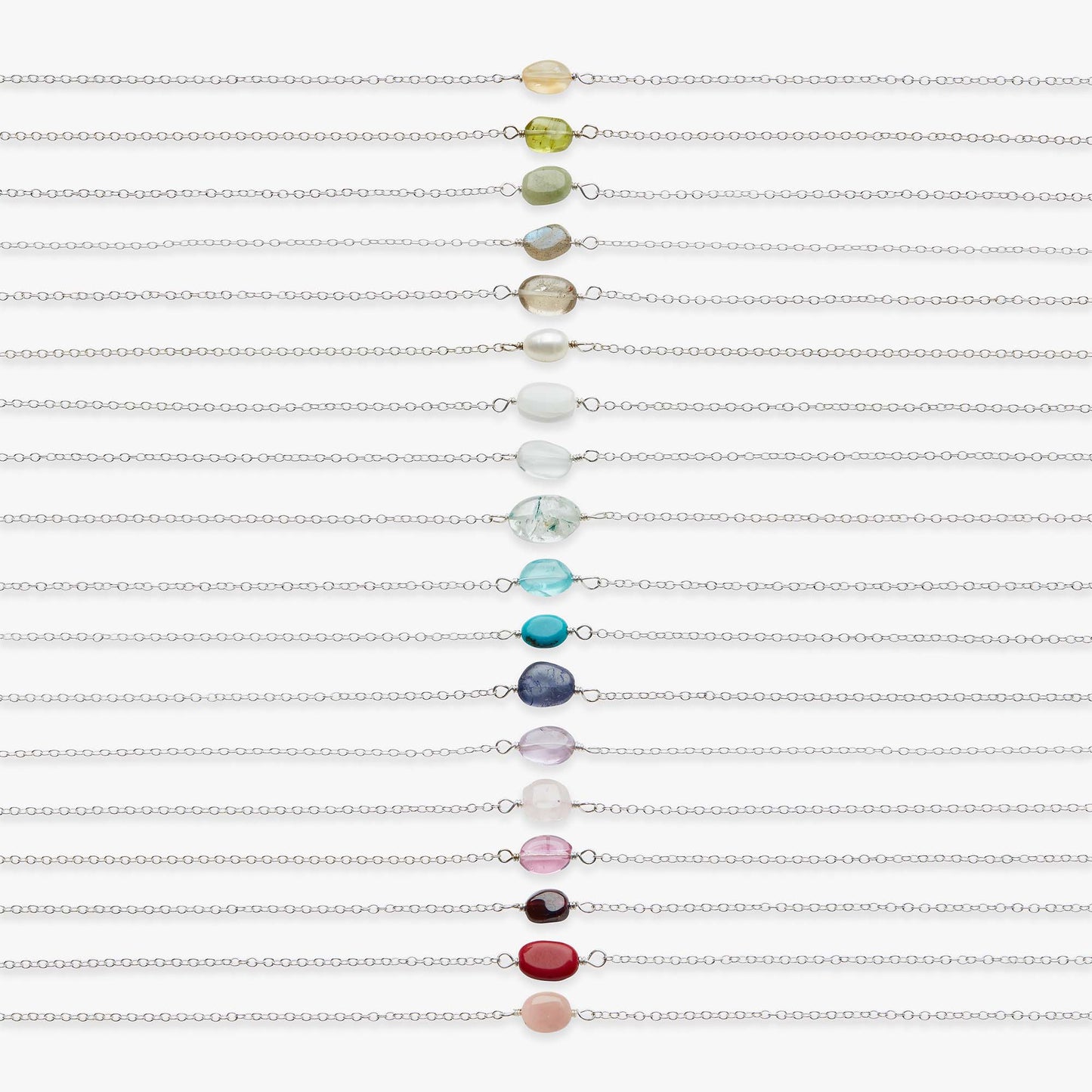 Set of colorful beaded bracelets on a white background