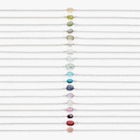Set of colorful beaded bracelets on a white background