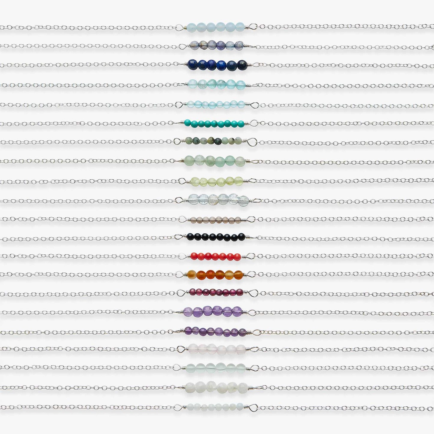 Multiple beaded chains in various colours on a white background