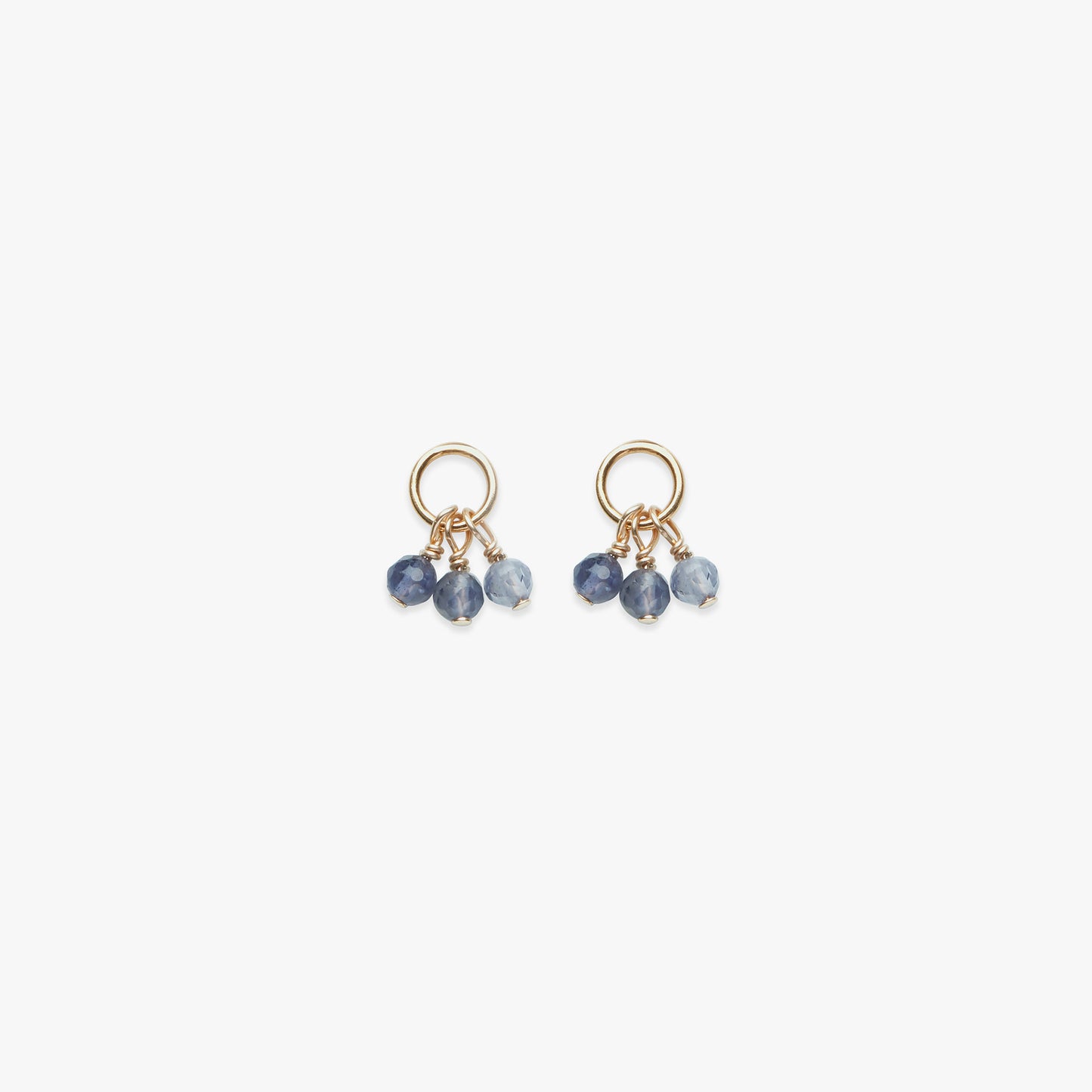 Pair of gold earrings with blue beads on a white background