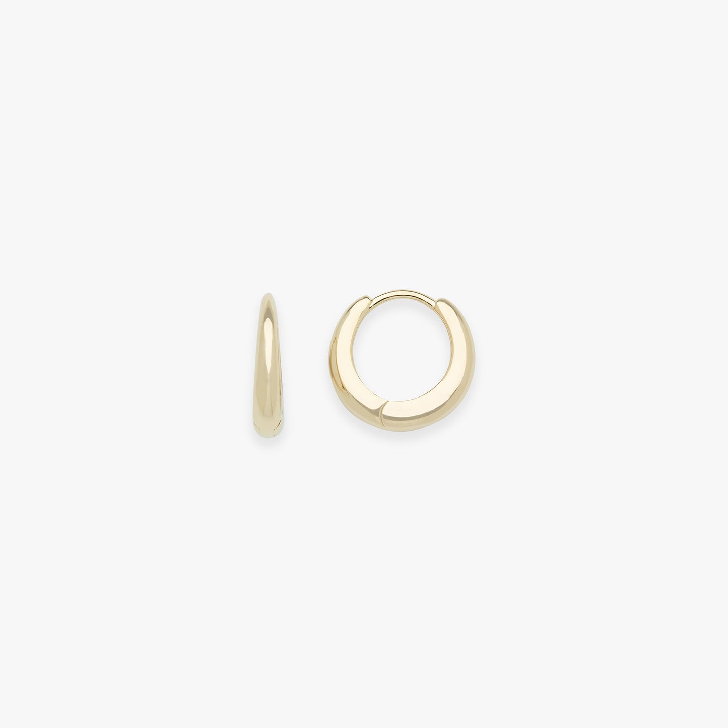 Gold hoop earrings on a white background