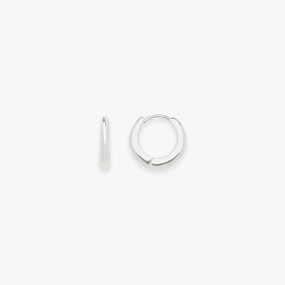 Pair of silver hoop earrings on a white background