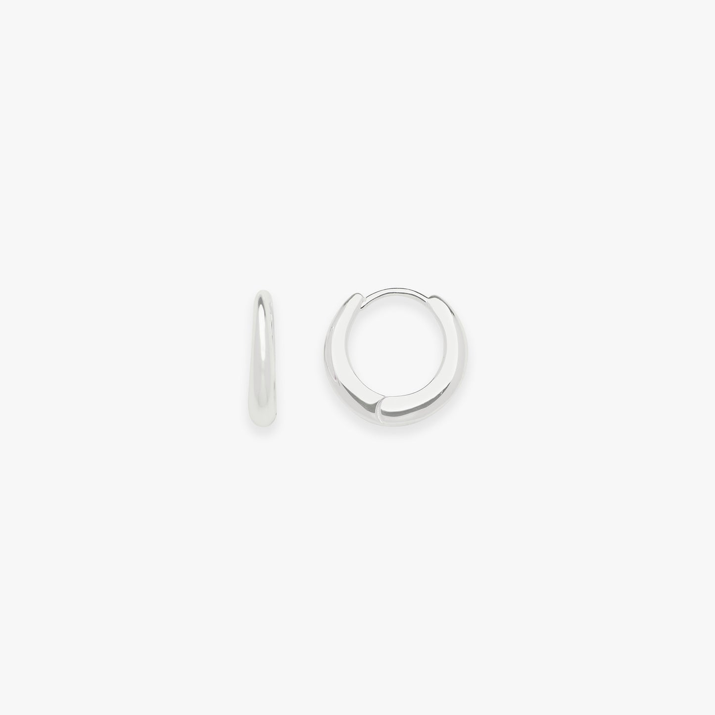 Pair of silver hoop earrings on a white background