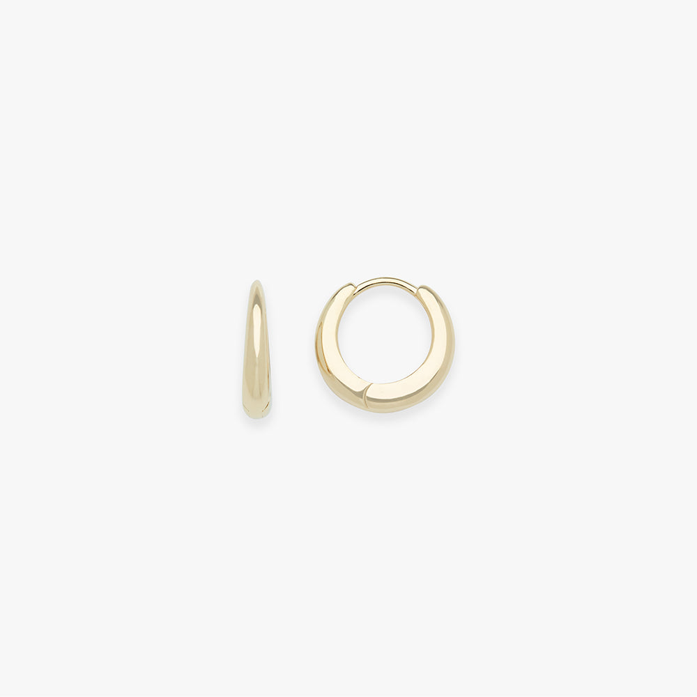 Gold hoop earrings on a white background