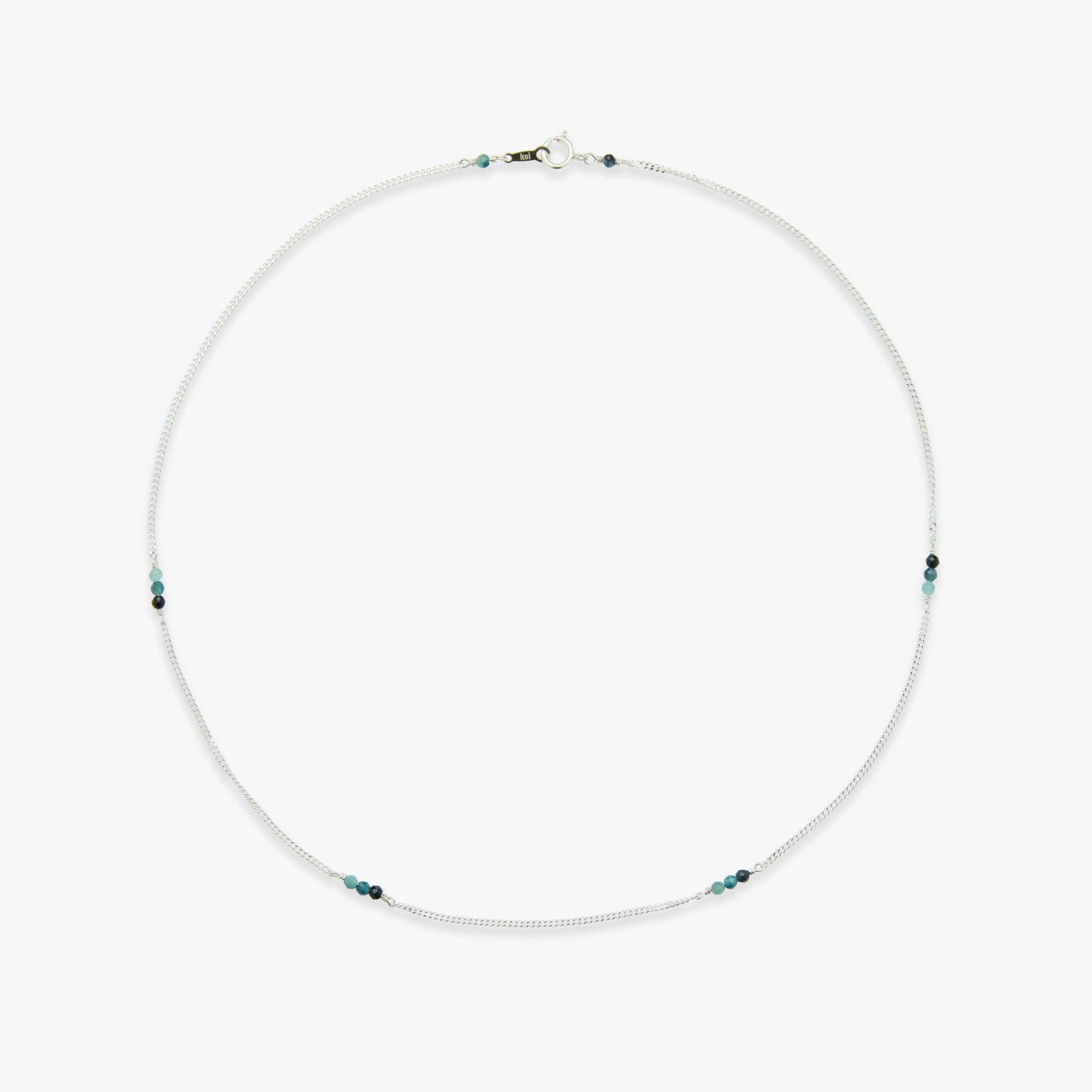 Necklace with small blue beads on a white background