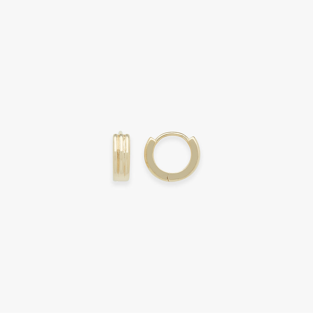 Gold hoop earrings on a white background