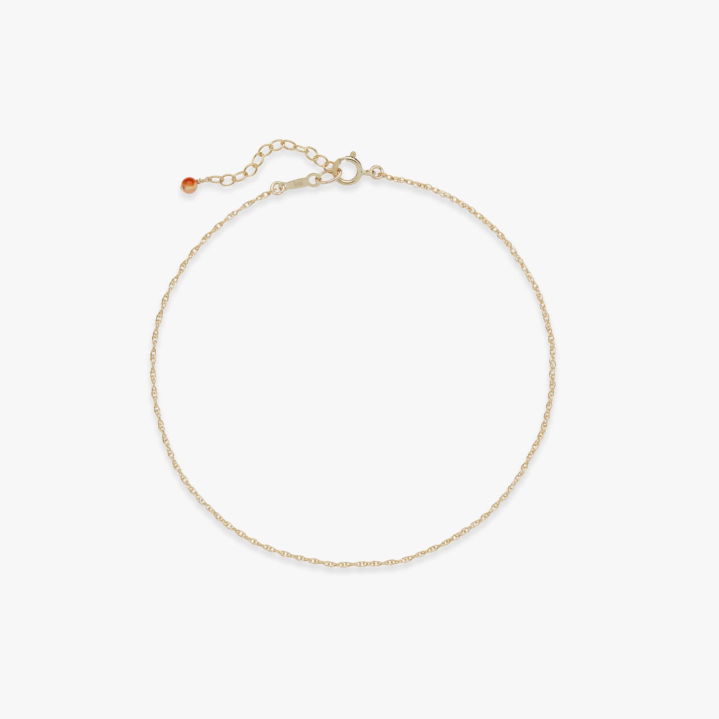 Gold anklet on a white background