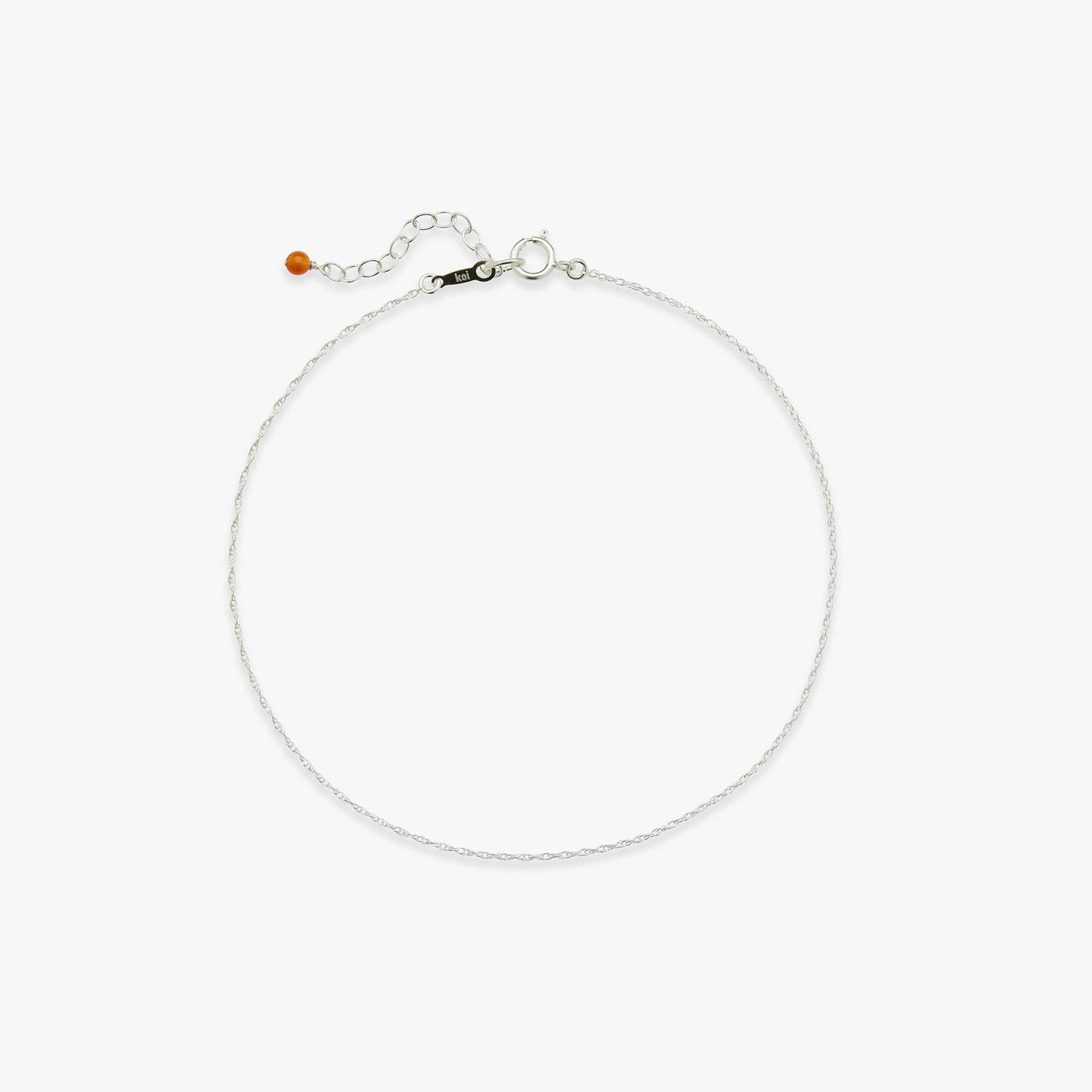 Silver tiny twist anklet on a white background