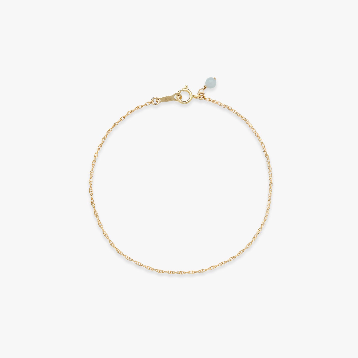 Gold twist bracelet on a white background