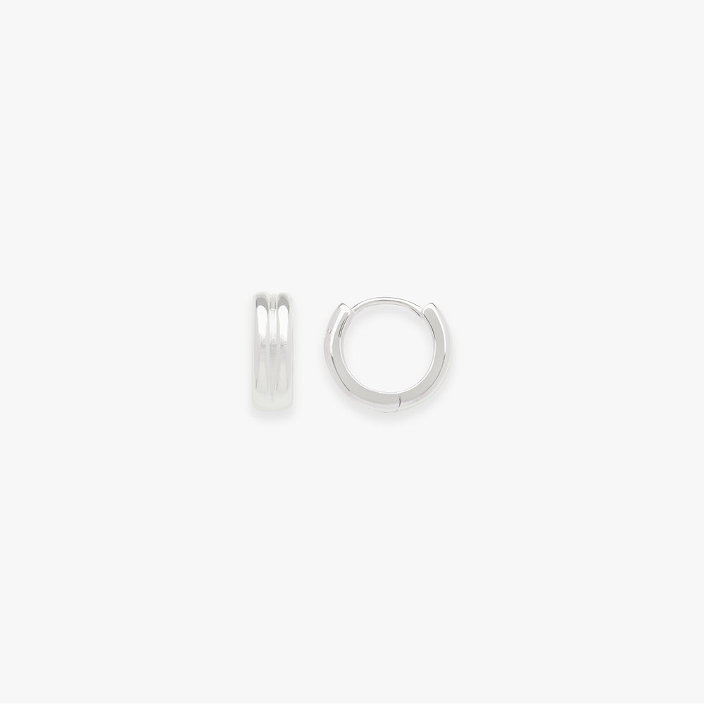Small silver hoop earrings on a white background