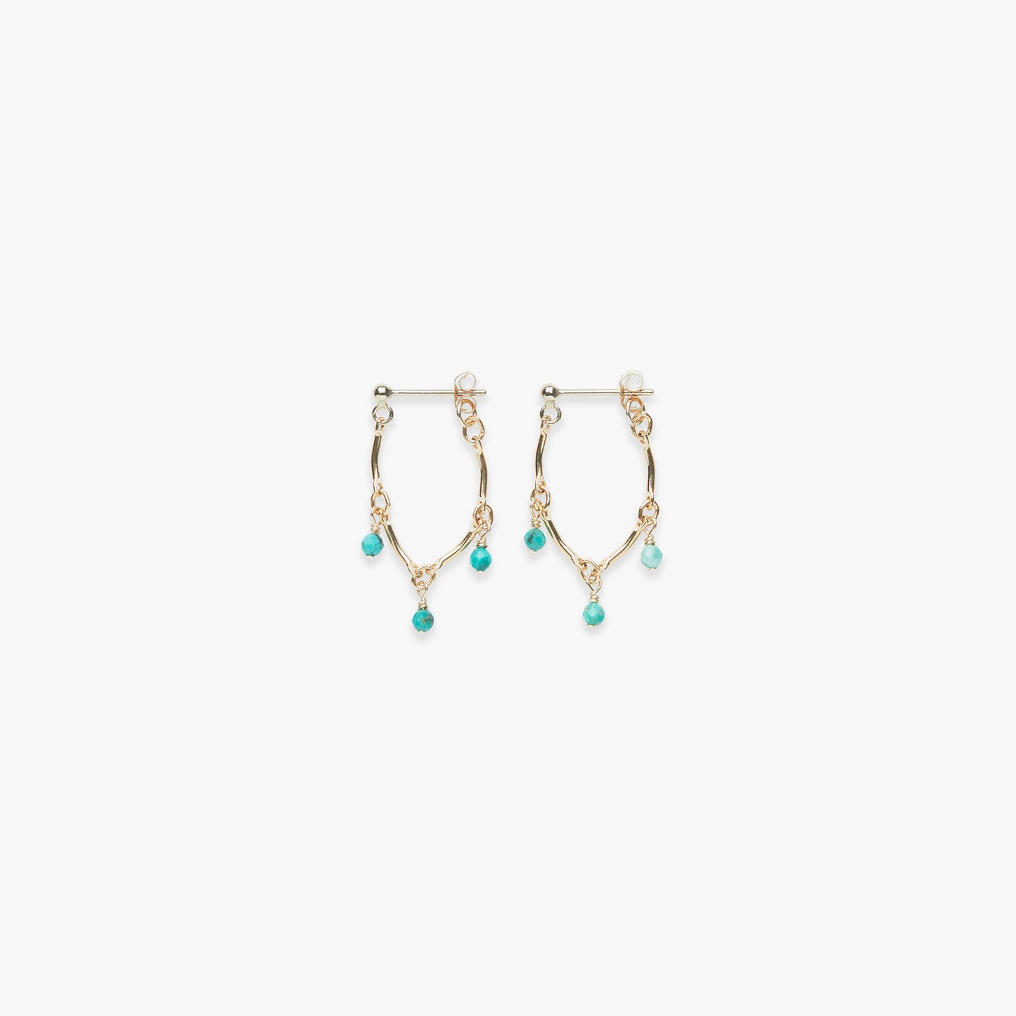 Gold hoop earrings with turquoise beads on a white background