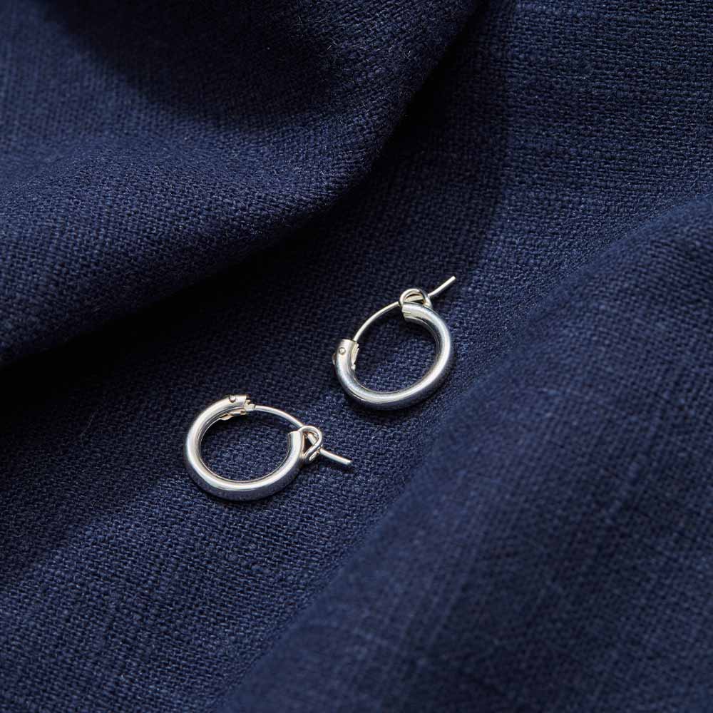 Thick silver hoop earring with clasp