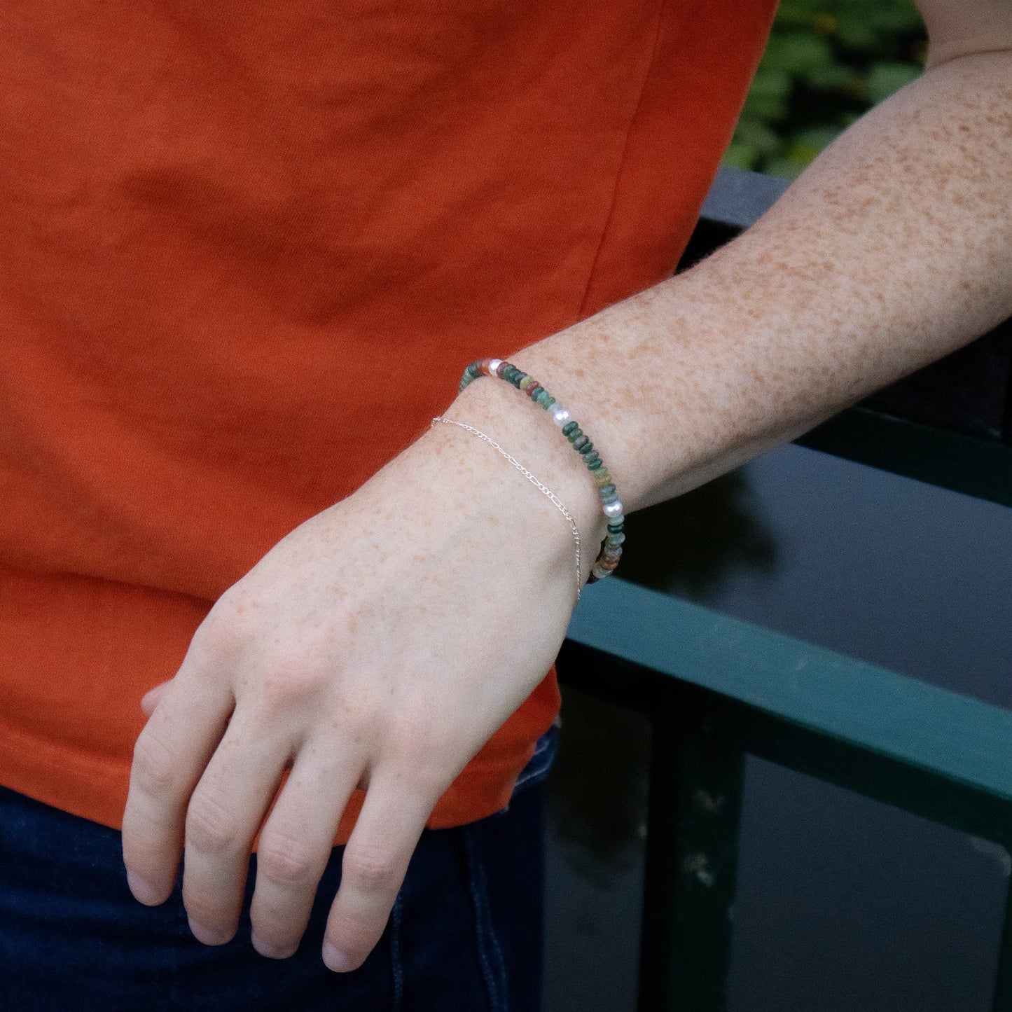 Person wearing a bracelet with a blurred background